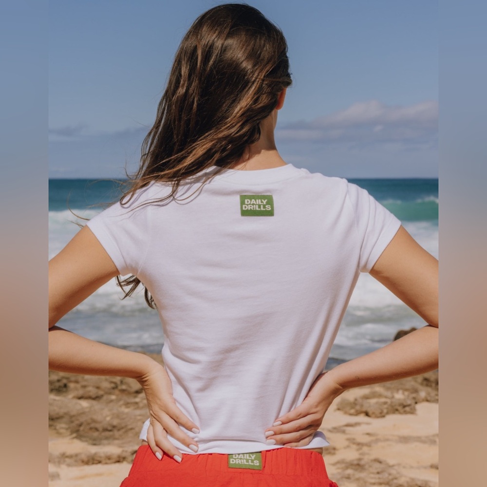 Daily Drills White Short Sleeve Tee with Green Logo
